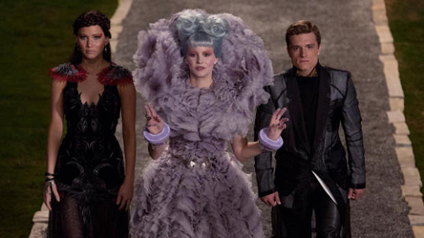 catching fire still, katniss, peeta and effie